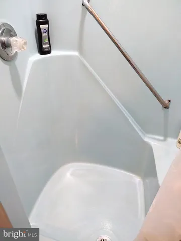 a bedroom with a bed and a chair