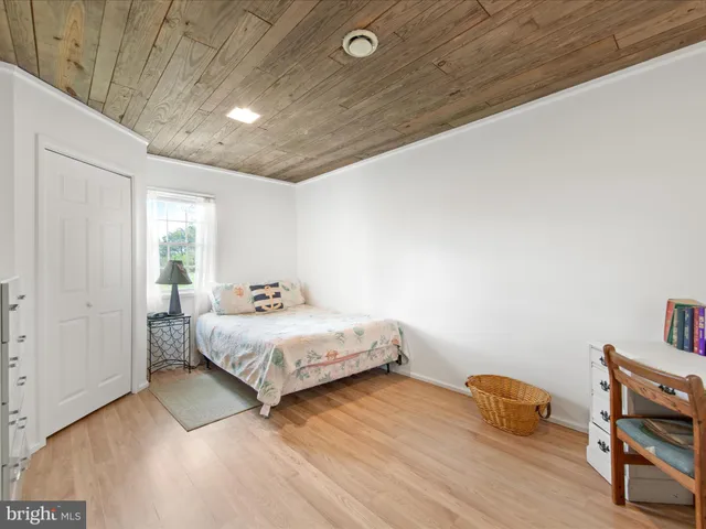 a bedroom with a bed and a table