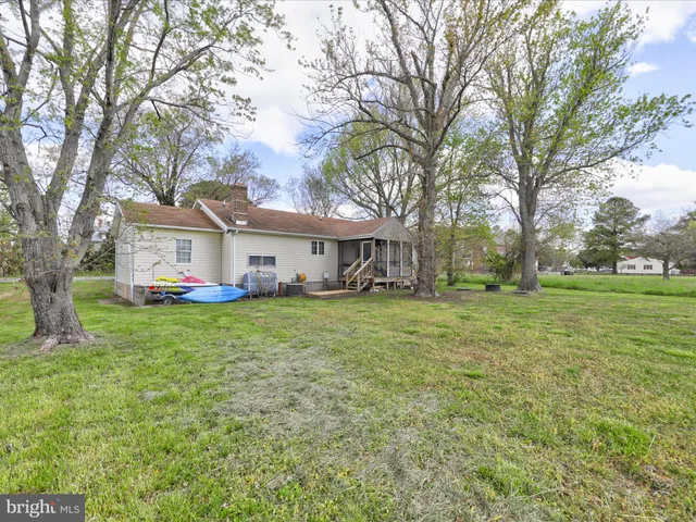 a view of house with yard and entertaining space