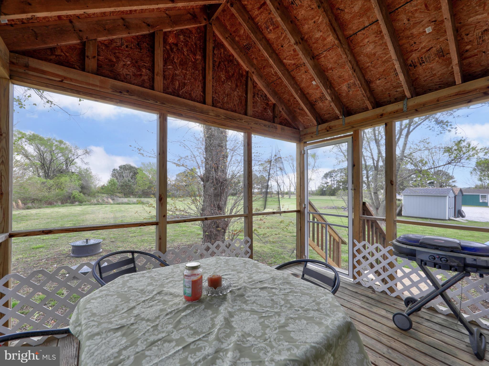 23451 Deal Island Road Deal Island, MD 21821 - Photo 6 of 49 a bedroom with furniture and large windows