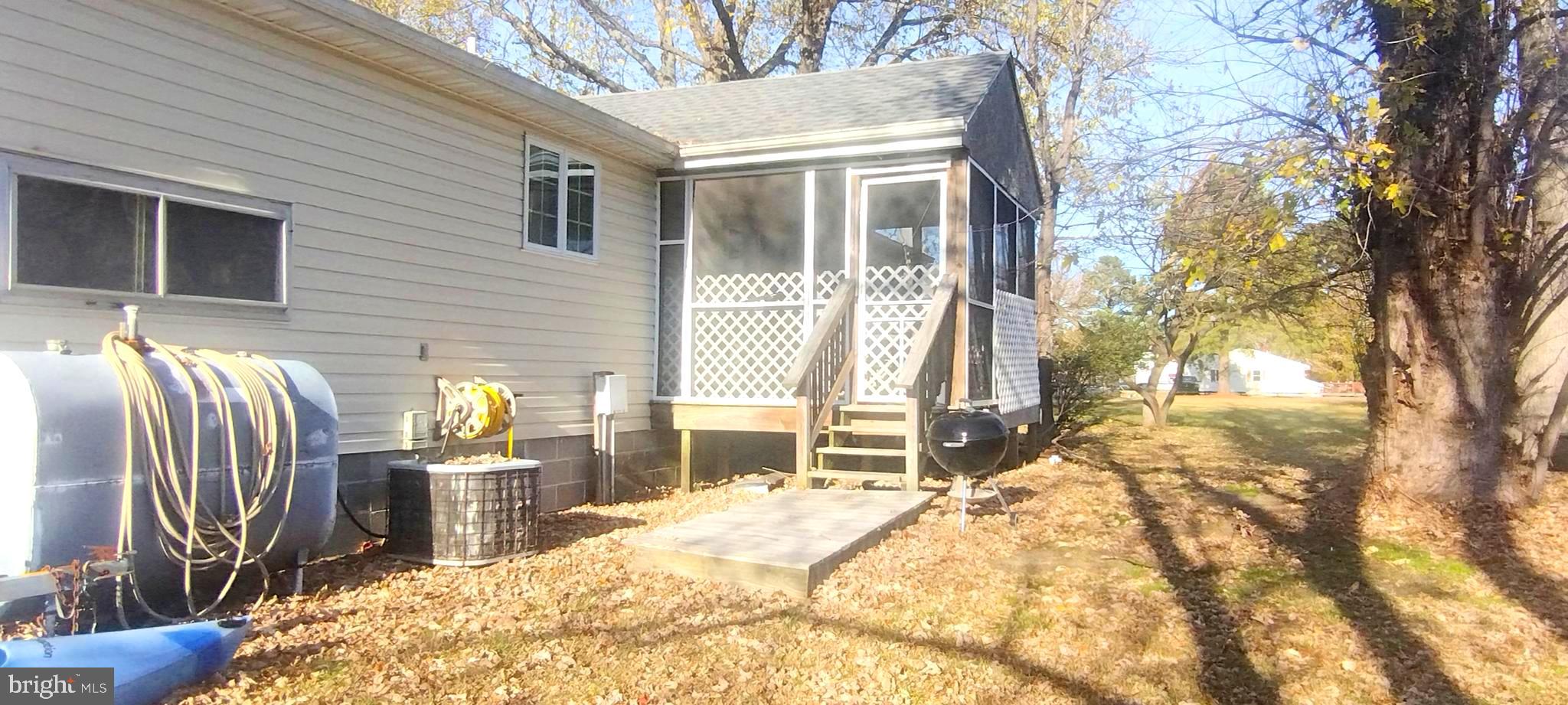 23451 Deal Island Road Deal Island, MD 21821 - Photo 8 of 49 a view of a house with backyard porch and sitting area