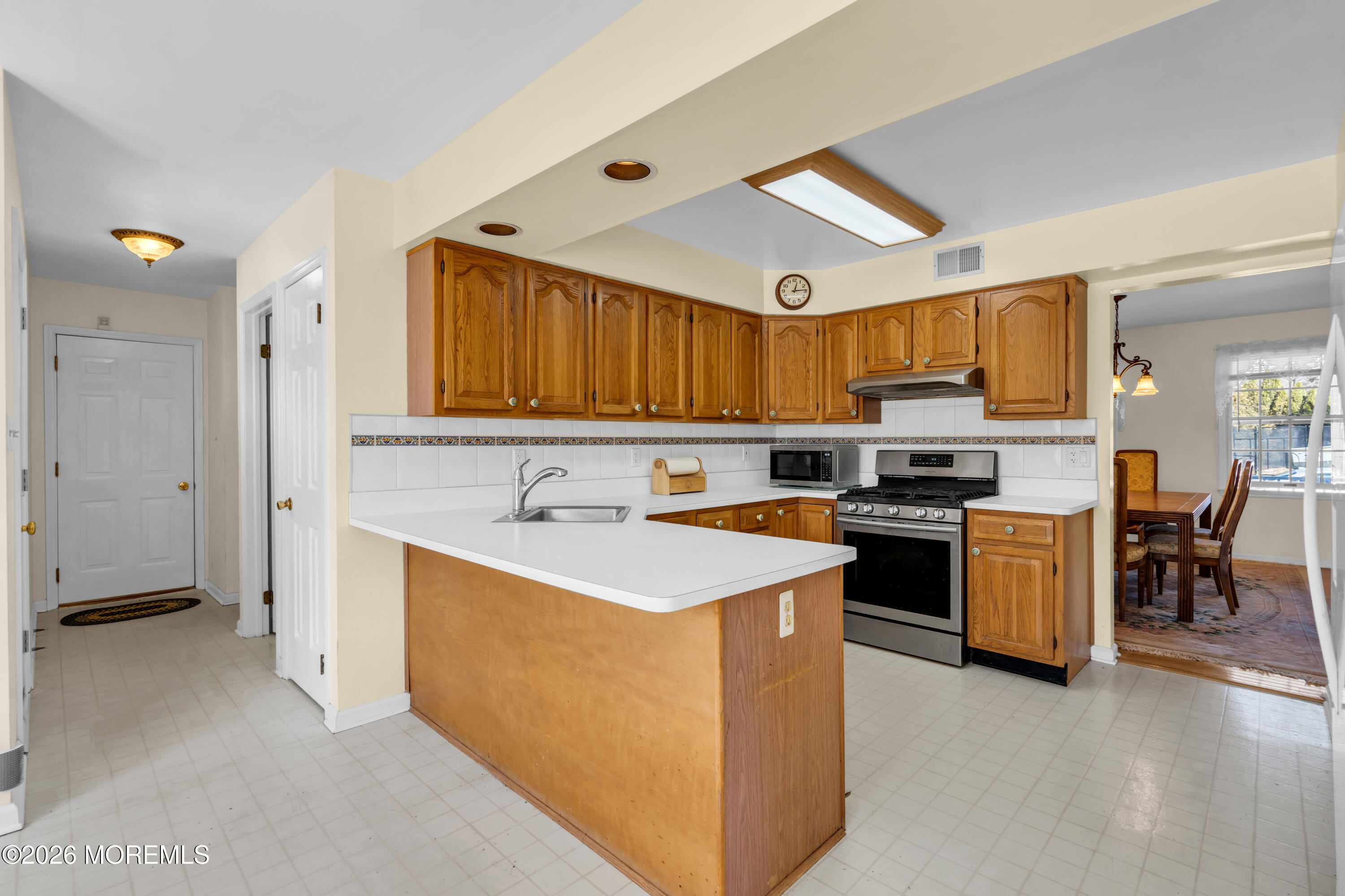 1 Wendy Court Jackson, NJ 08527 - Photo 11 of 33 a kitchen with a sink and a stove top oven