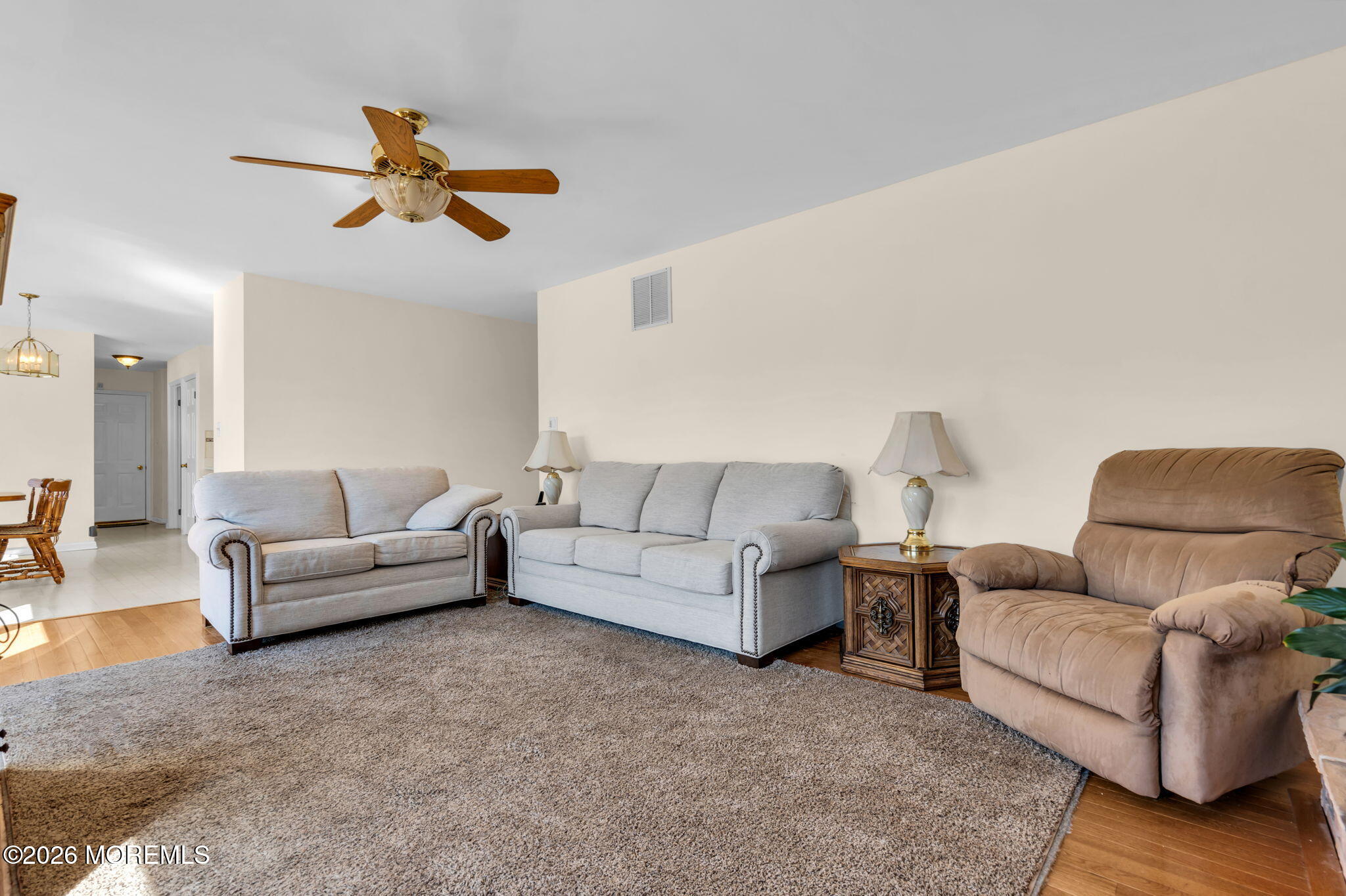 1 Wendy Court Jackson, NJ 08527 - Photo 15 of 33 a living room with furniture and a chandelier