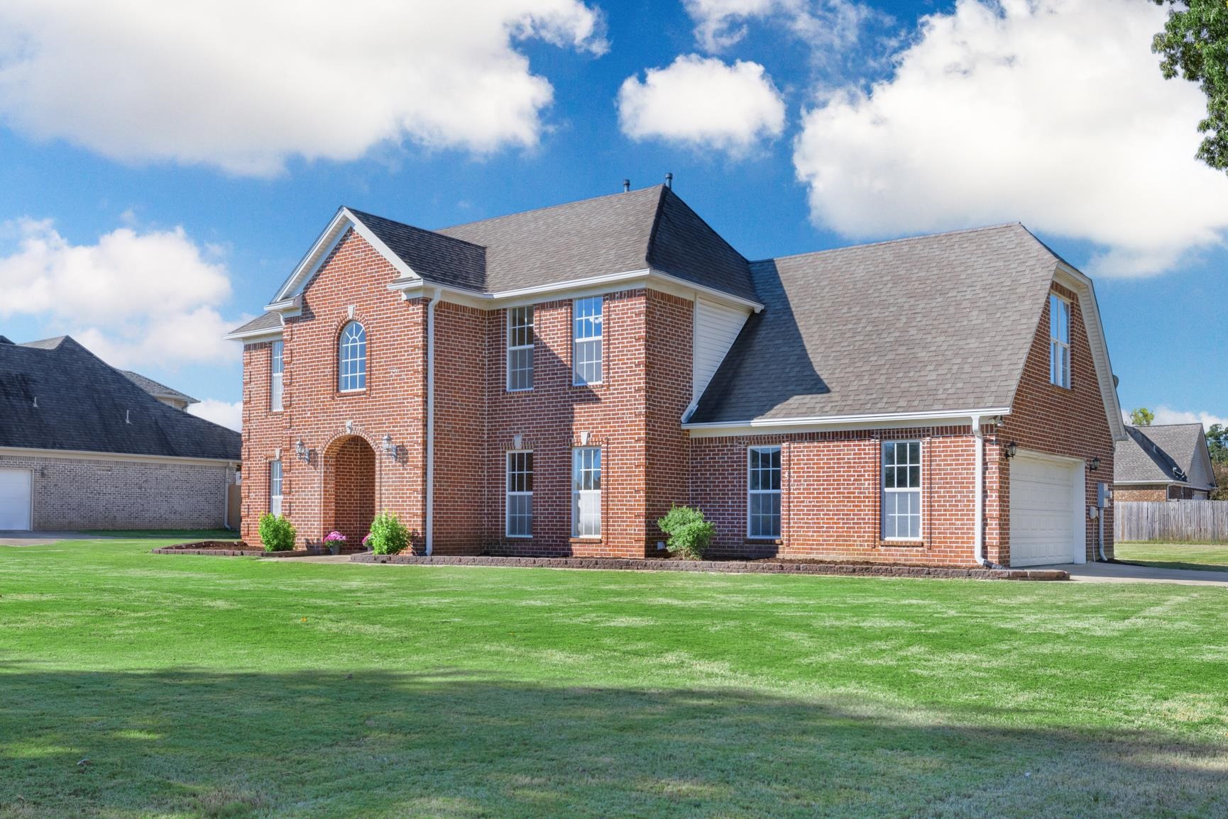 251 Rosemark Road Atoka, TN 38004 - Photo 2 of 40 View of front of home with a front yard and a garage