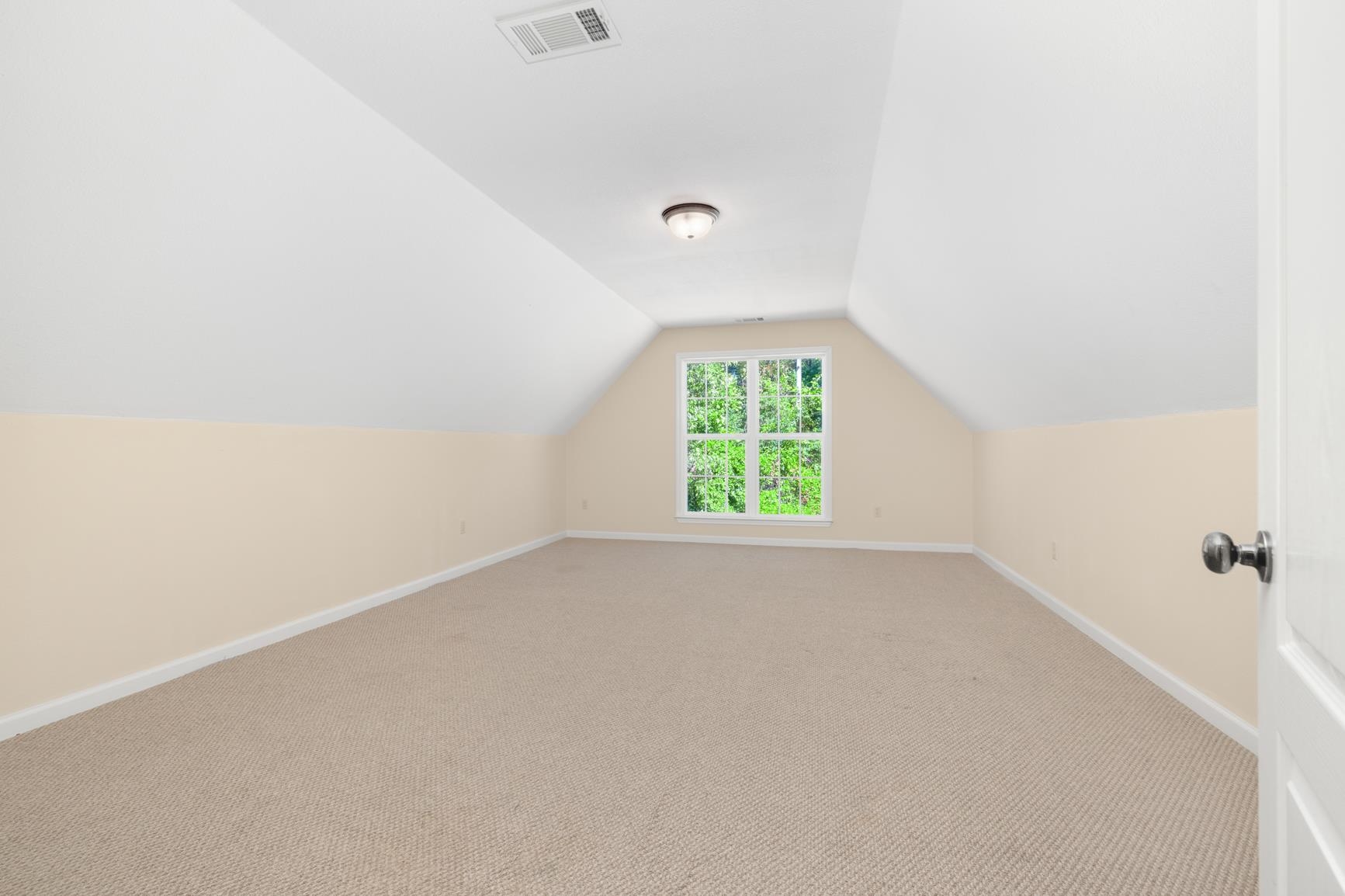 251 Rosemark Road Atoka, TN 38004 - Photo 36 of 40 Additional living space featuring vaulted ceiling and light carpet