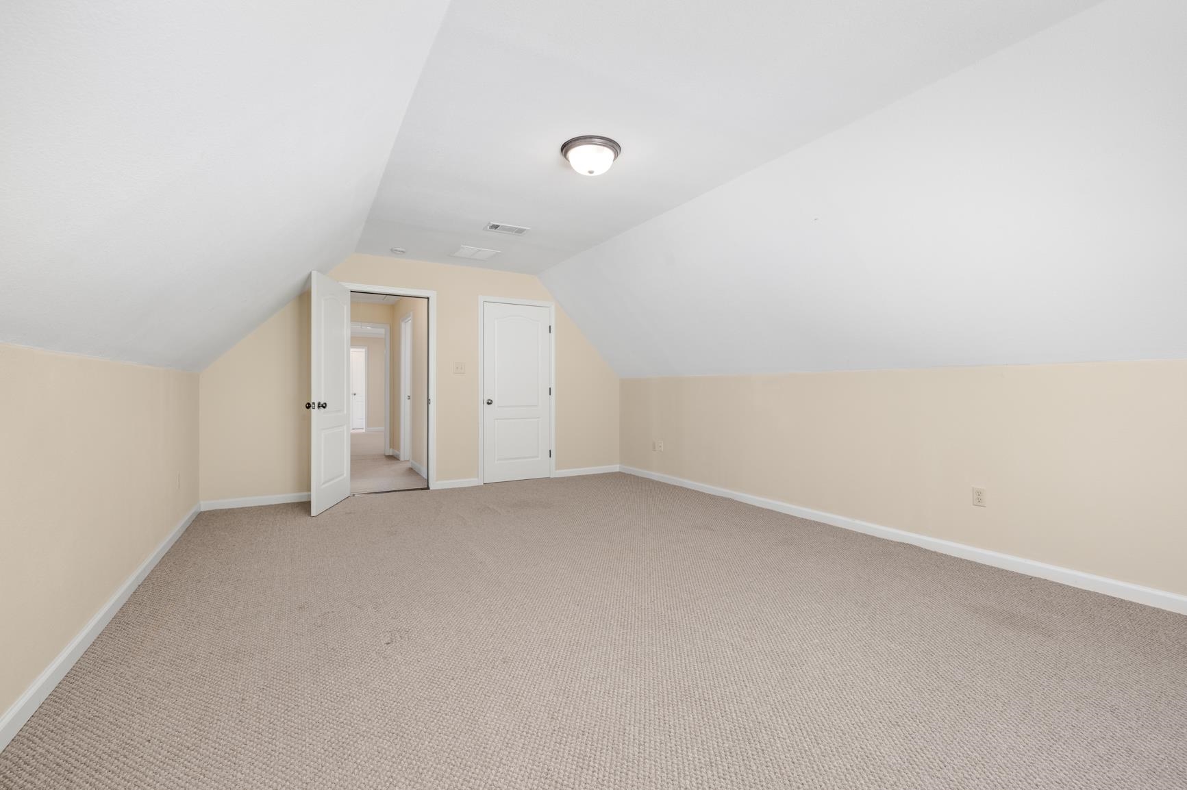 251 Rosemark Road Atoka, TN 38004 - Photo 37 of 40 Bonus room featuring lofted ceiling and light colored carpet