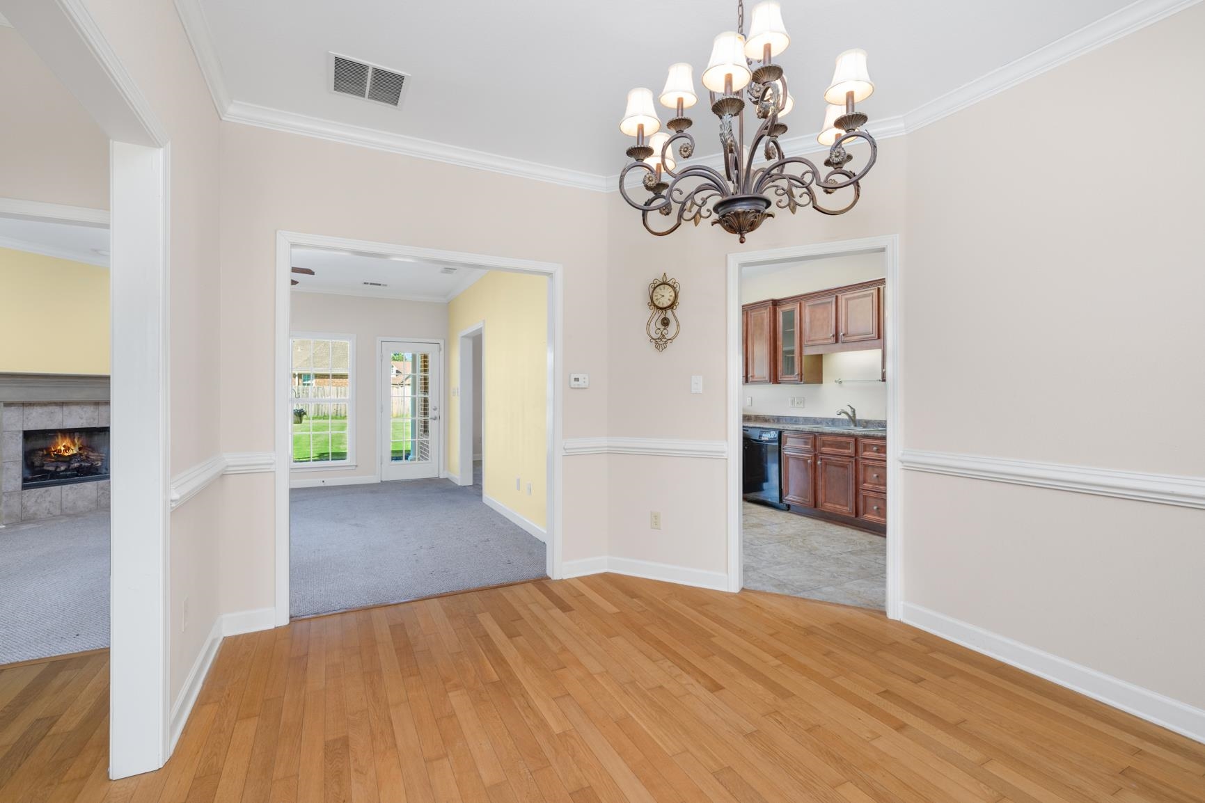 251 Rosemark Road Atoka, TN 38004 - Photo 6 of 40 Dining area featuring ornamental molding, a notable chandelier, and light wood flooring