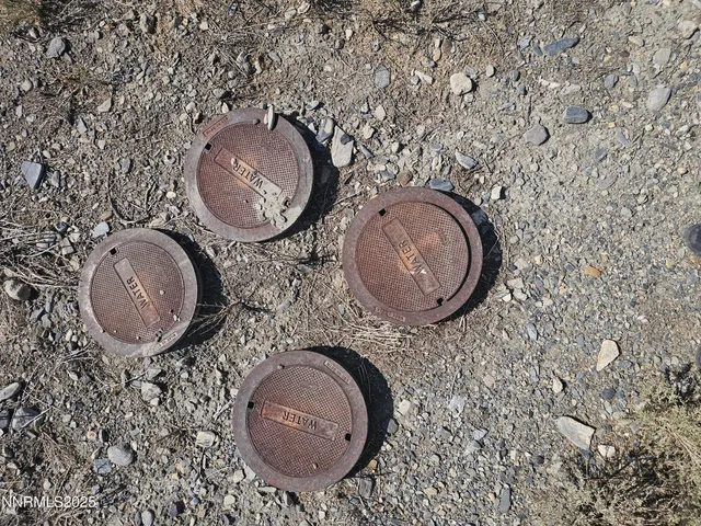 an aerial view of a house with kitchen view and a wooden floor
