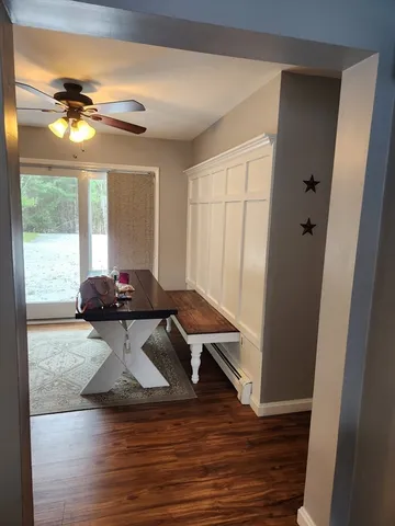 a view of a dining room with furniture wooden floor and chandelier