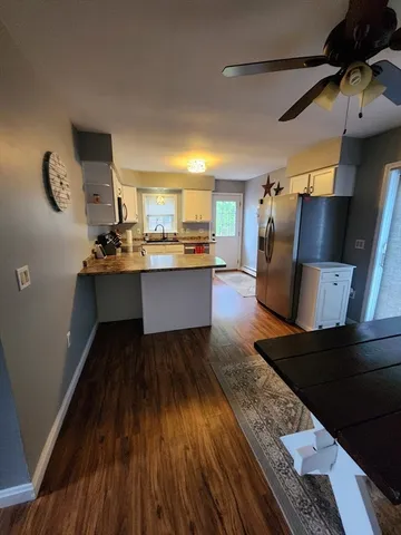 a view of kitchen island with wooden floor