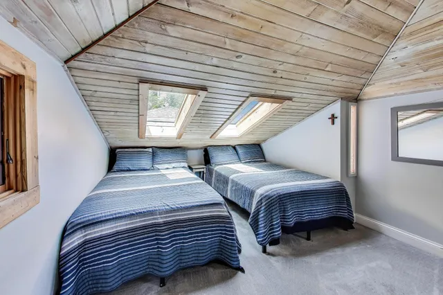 a bedroom with bed and a window