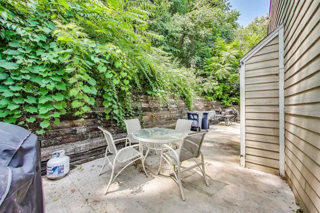 a view of a backyard with sitting area
