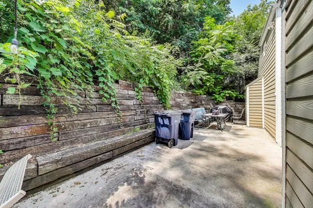 a view of a backyard with sitting area