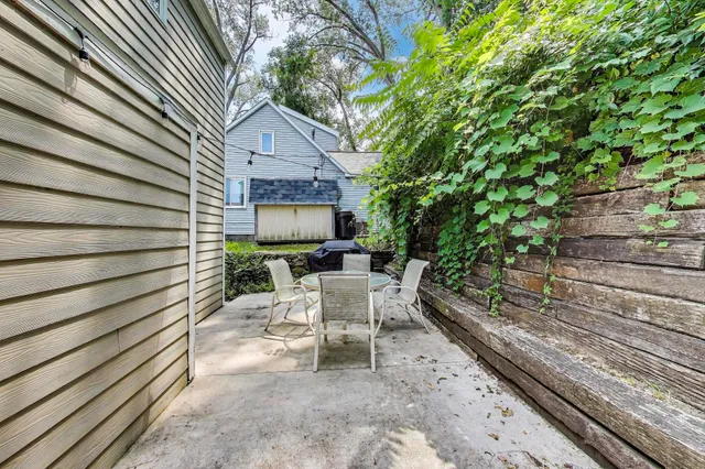 a view of backyard with sitting area
