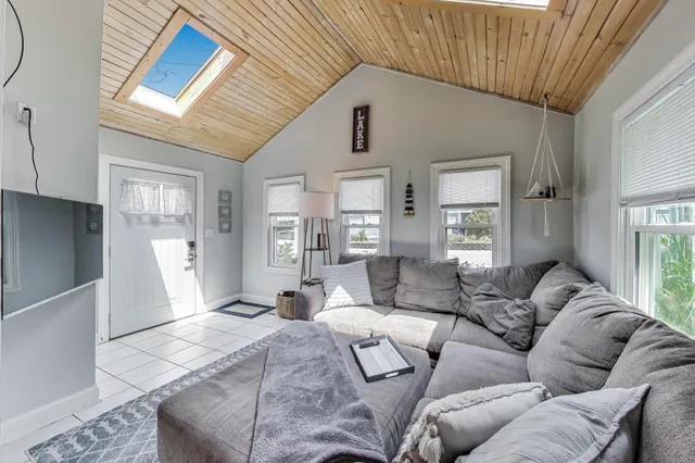 a large bedroom with furniture and a window