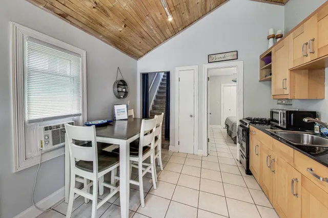 a kitchen with stainless steel appliances kitchen island granite countertop a sink and cabinets