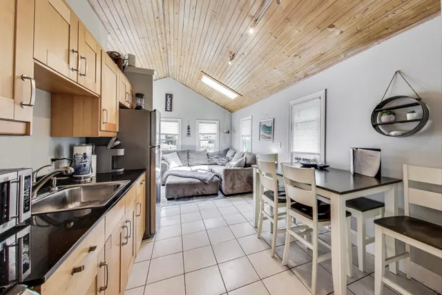 a kitchen with stainless steel appliances a sink a stove and a refrigerator