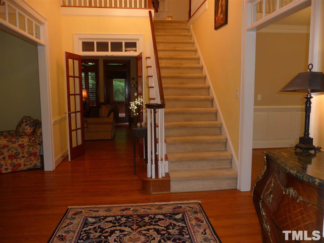 4733 Sharpstone Lane Raleigh, NC 27615 - Photo 2 of 23 a view of entryway and hall with wooden floor
