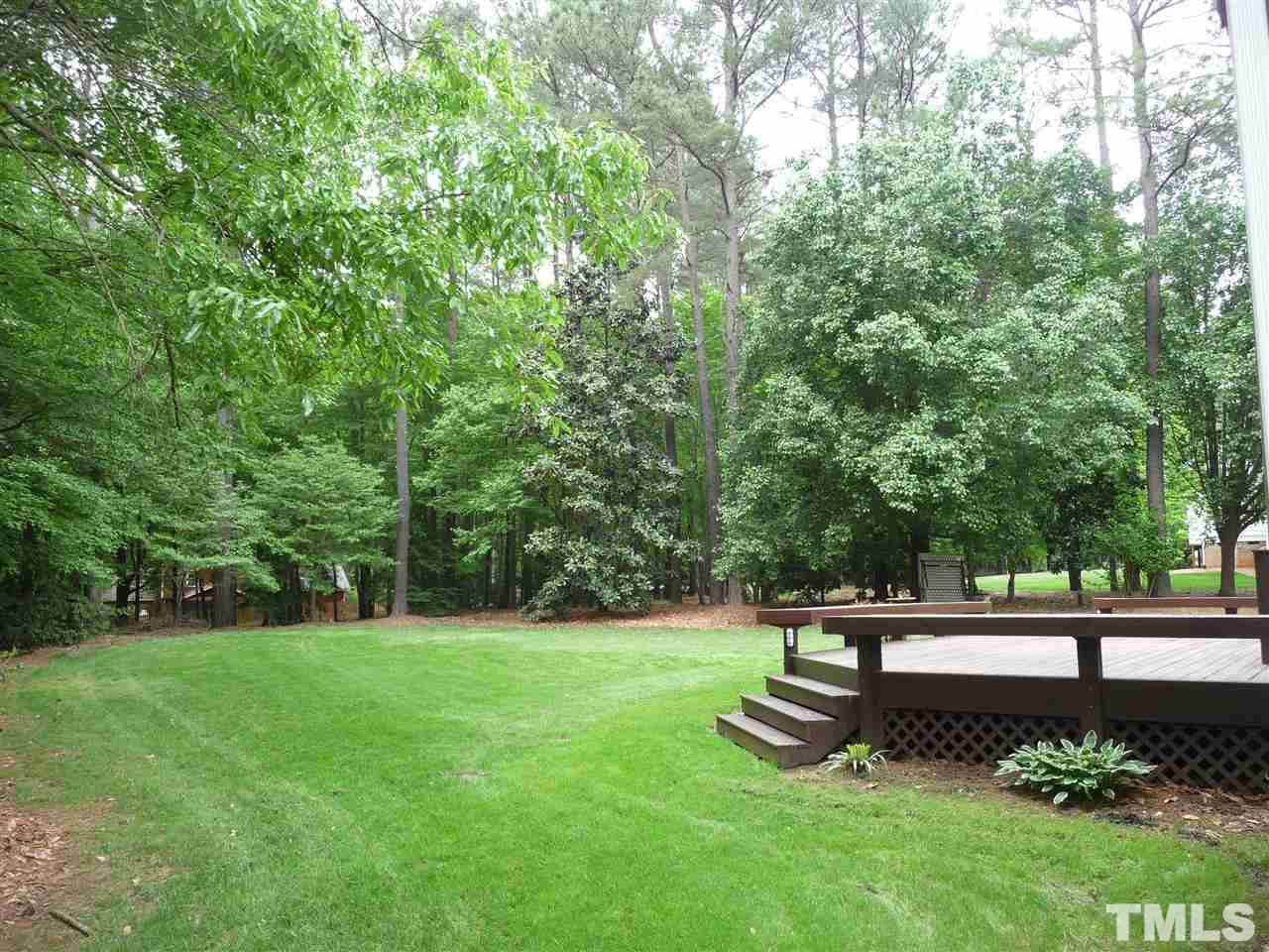 4733 Sharpstone Lane Raleigh, NC 27615 - Photo 12 of 23 a view of a bench in a garden