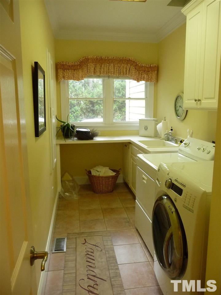 4733 Sharpstone Lane Raleigh, NC 27615 - Photo 13 of 23 a utility room with dryer and washer