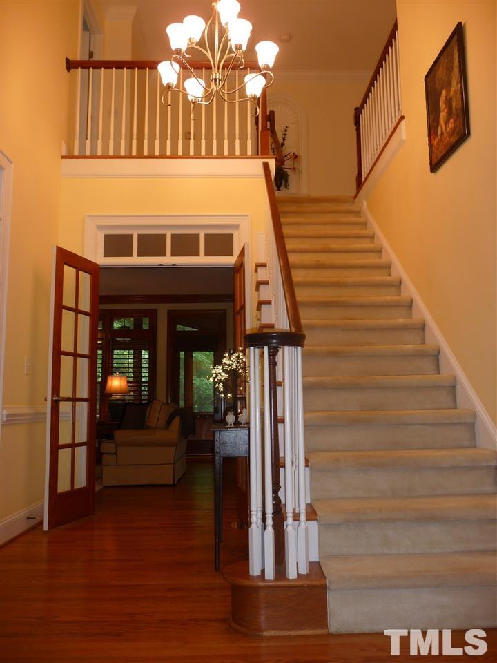 4733 Sharpstone Lane Raleigh, NC 27615 - Photo 16 of 23 a view of entryway and hall with wooden floor