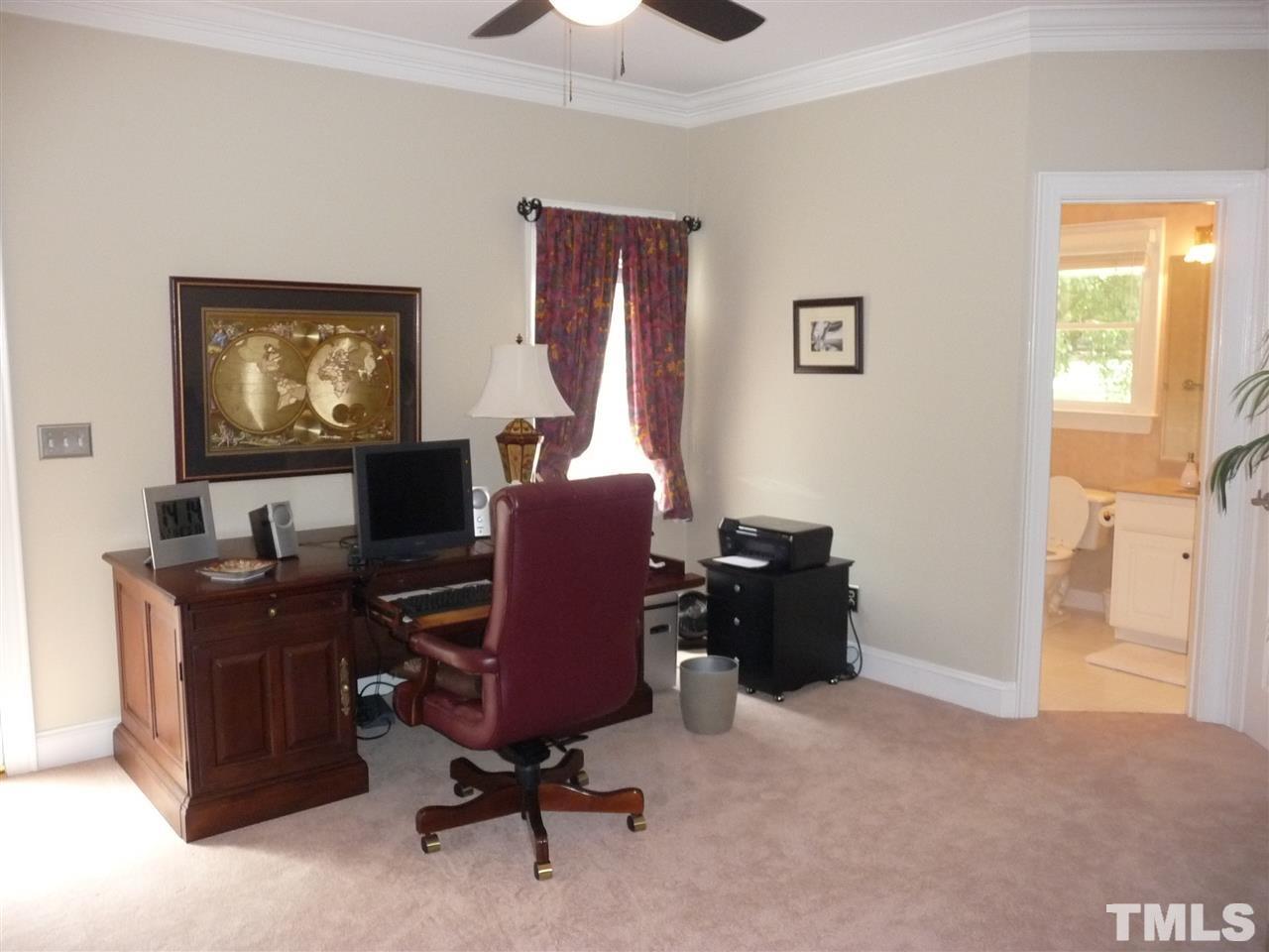 4733 Sharpstone Lane Raleigh, NC 27615 - Photo 19 of 23 a view of a workspace with furniture and a window