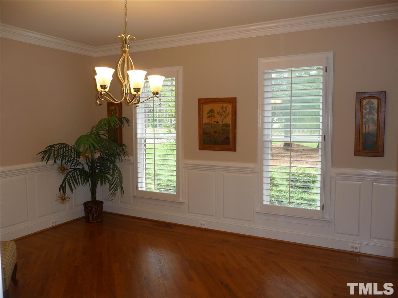 4733 Sharpstone Lane Raleigh, NC 27615 - Photo 3 of 23 a view of a room with wooden flooring and chandelier
