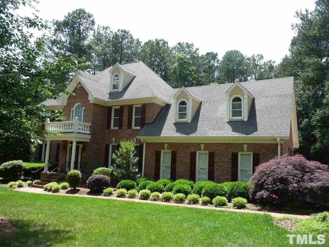 4733 Sharpstone Lane Raleigh, NC 27615 - Photo 21 of 23 a front view of a house with a garden and plants