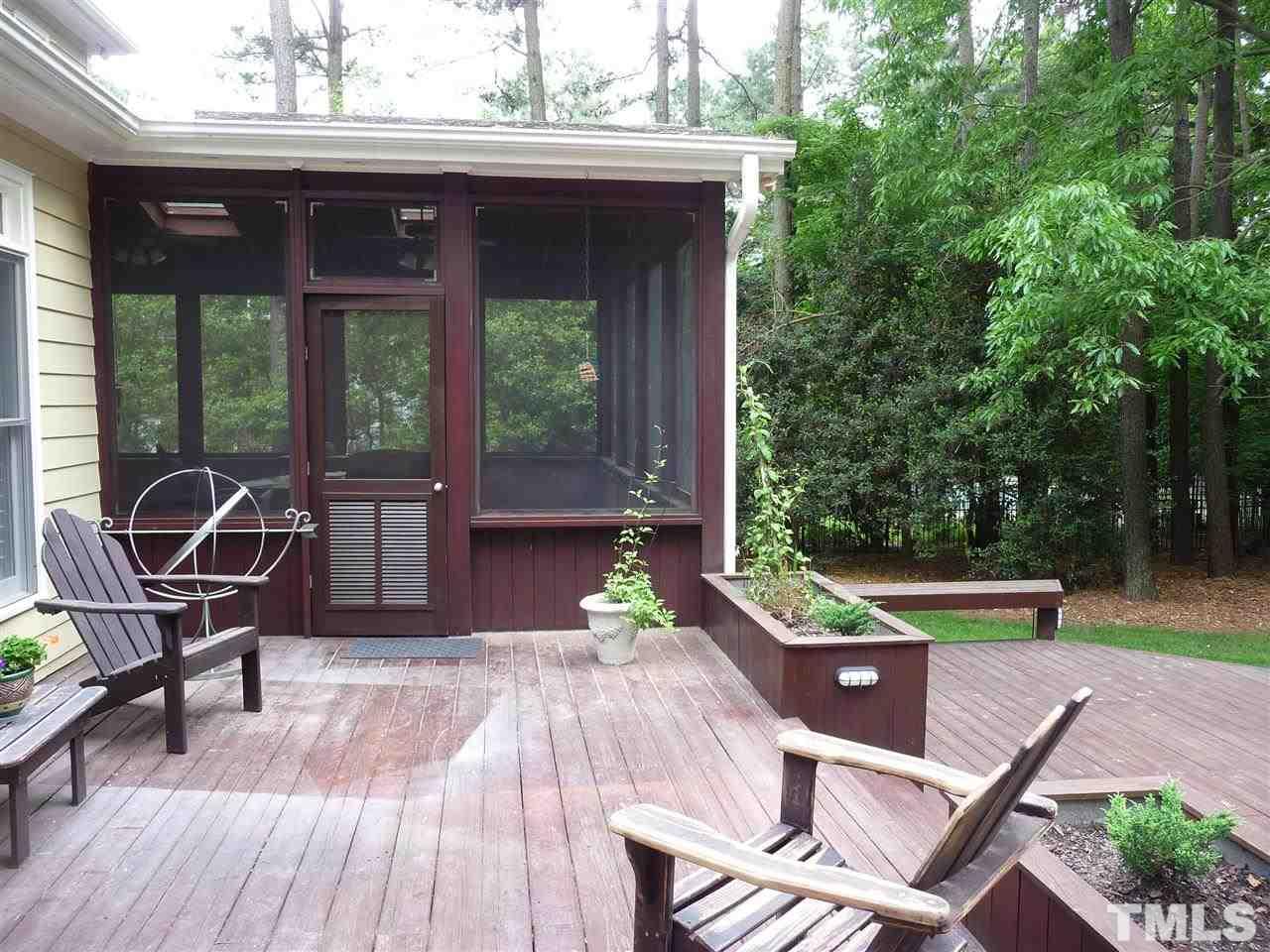 4733 Sharpstone Lane Raleigh, NC 27615 - Photo 22 of 23 a view of a patio with table and chairs and wooden floor