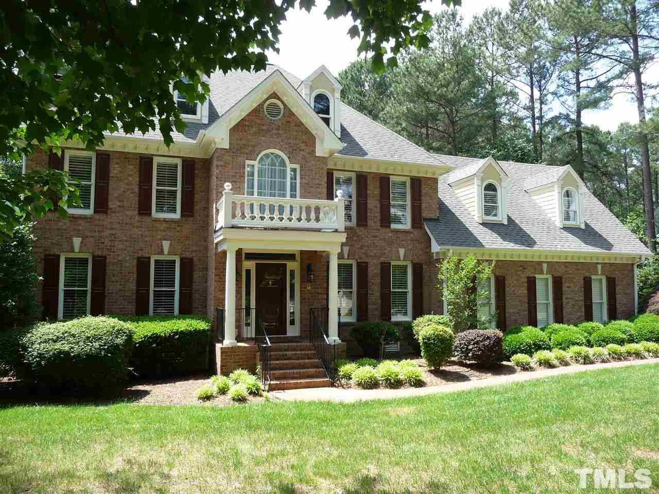 4733 Sharpstone Lane Raleigh, NC 27615 - Photo 23 of 23 a front view of a house with a yard and green space
