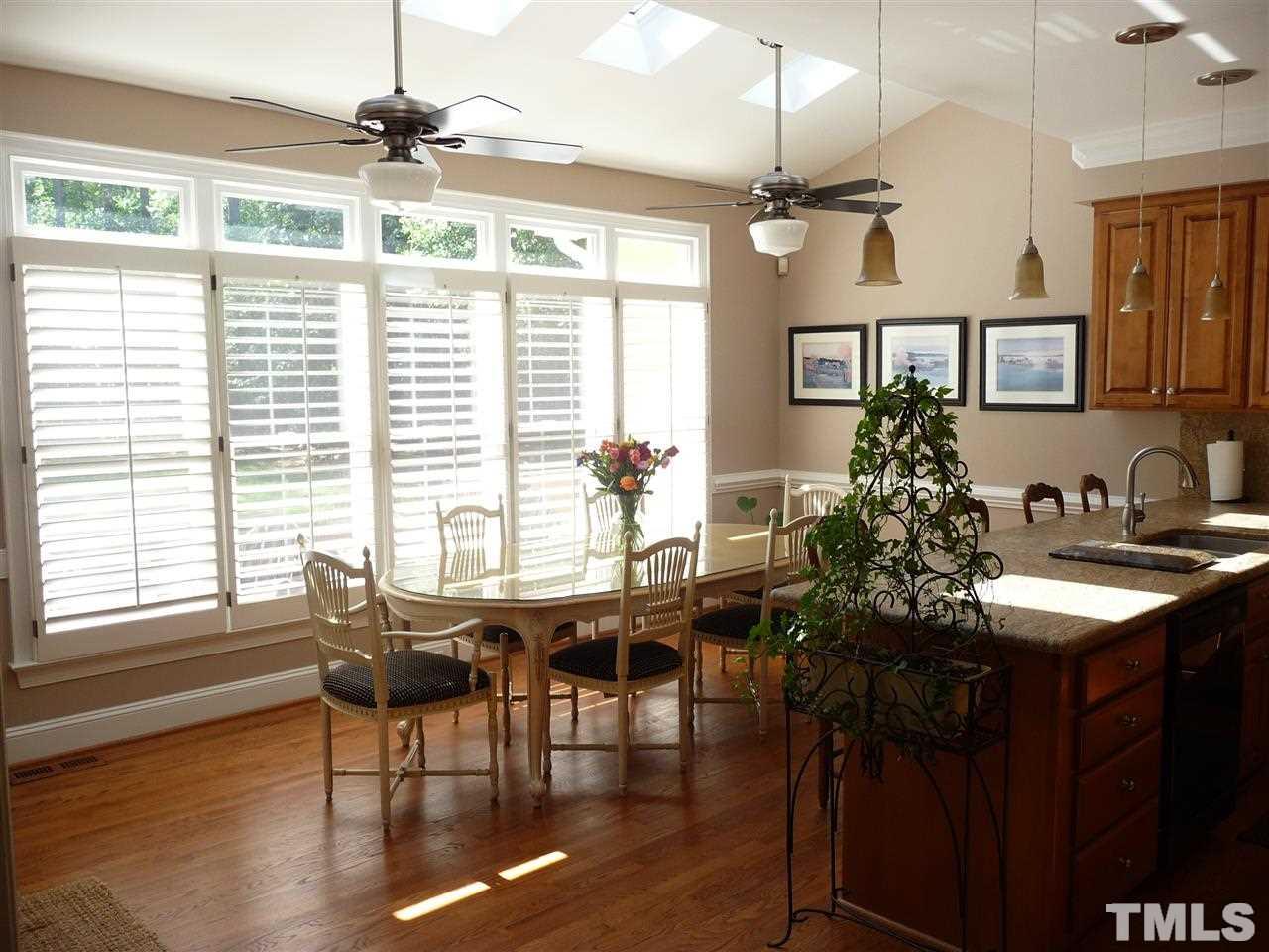 4733 Sharpstone Lane Raleigh, NC 27615 - Photo 6 of 23 a view of a livingroom with furniture window and wooden floor