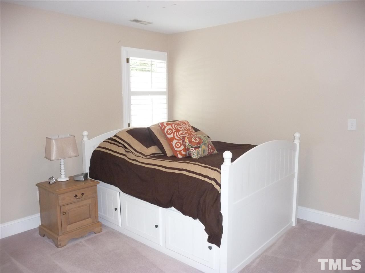 4733 Sharpstone Lane Raleigh, NC 27615 - Photo 10 of 23 a bedroom with a bed and a window