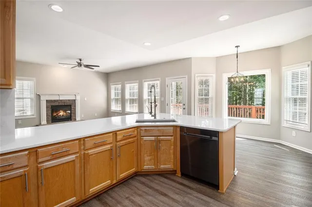 a large kitchen with sink and cabinets