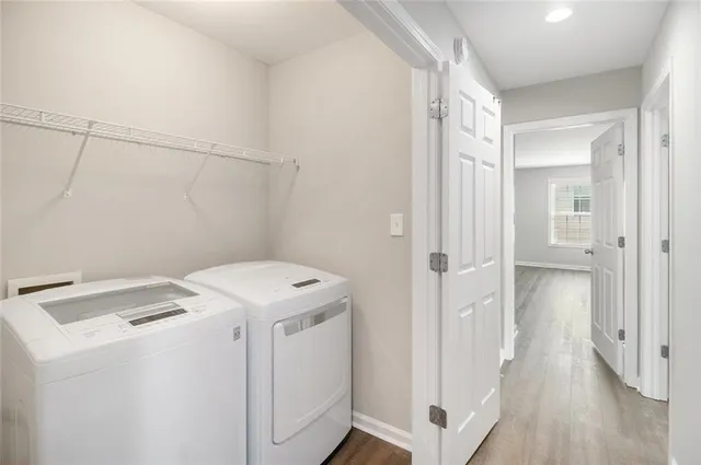 a view of storage and utility room with closet