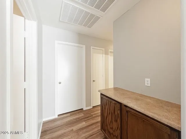 a view of kitchen with wooden floor