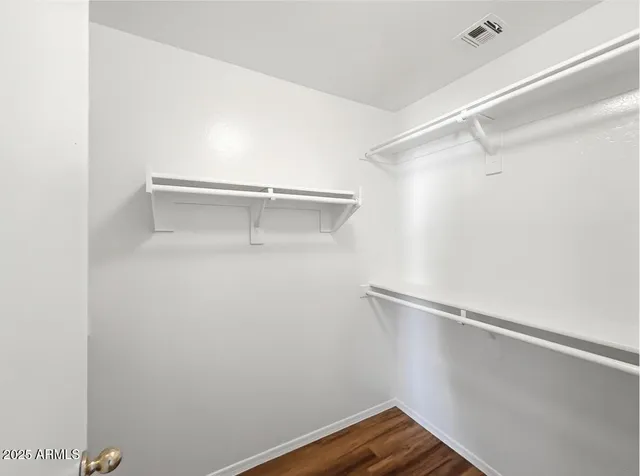 a view of an empty walk in closet