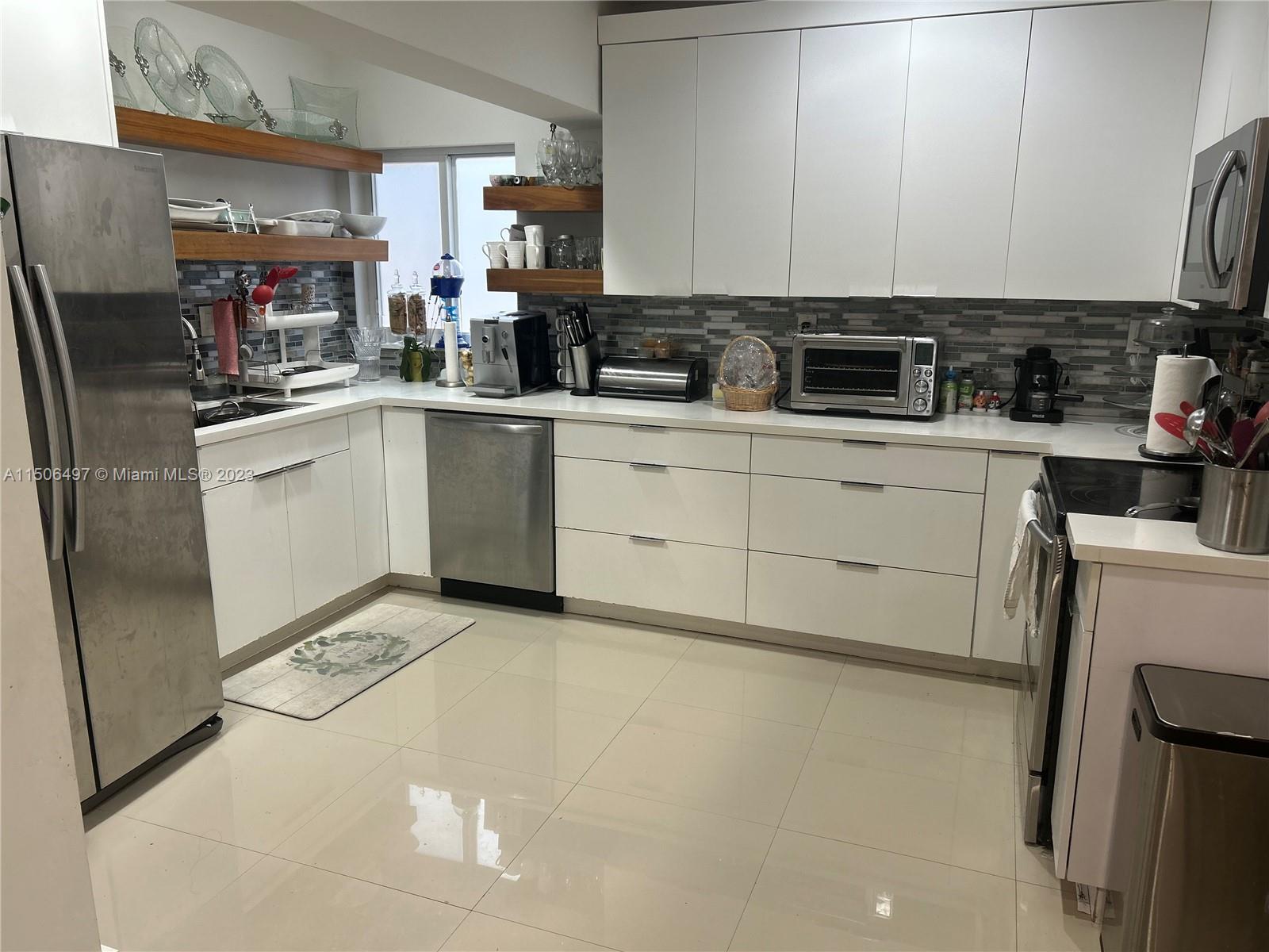 Coral Gate Miami, FL 33145 - Photo 11 of 13 a kitchen with a sink cabinets and appliances