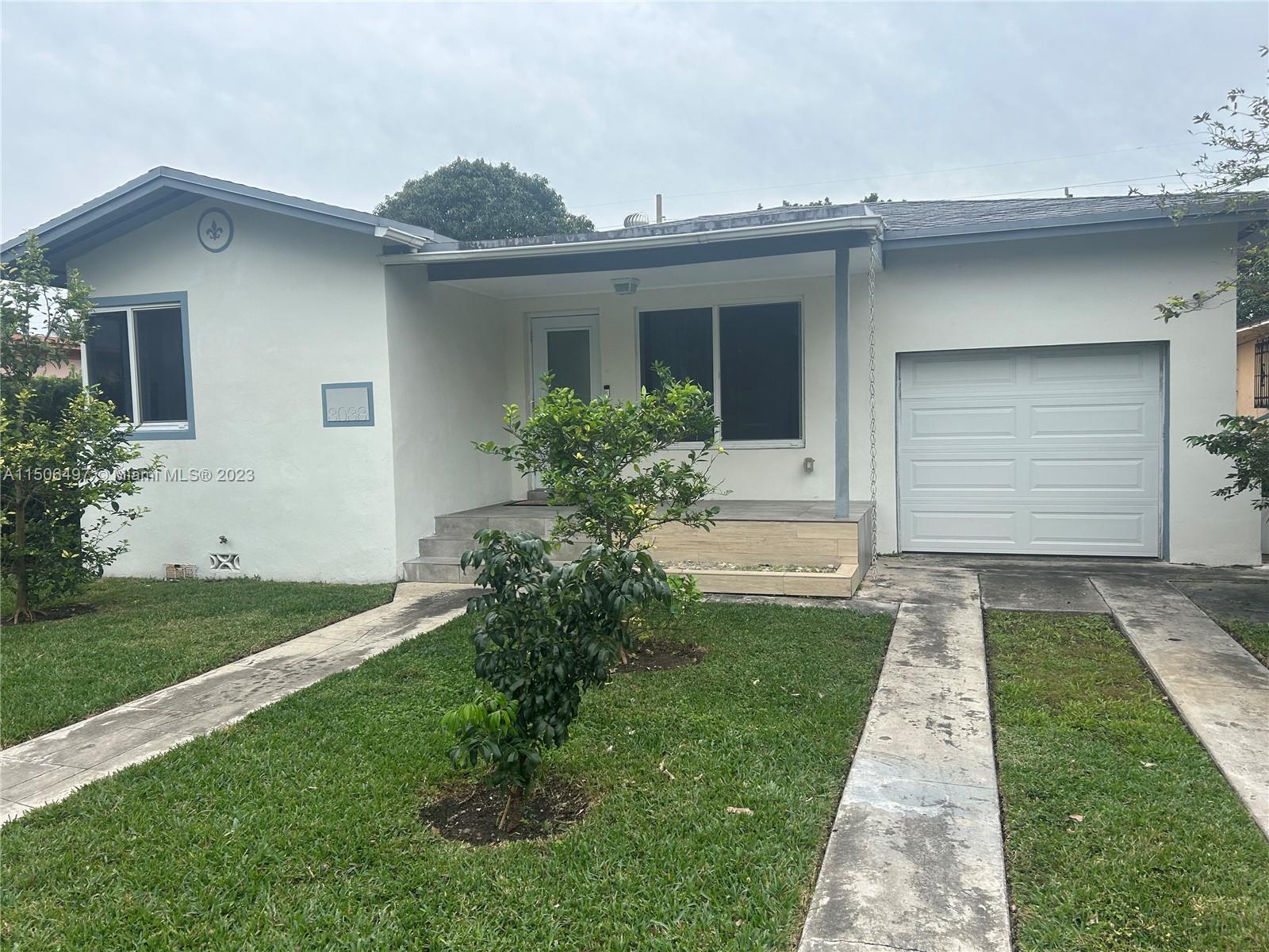Coral Gate Miami, FL 33145 - Photo 2 of 13 a front view of house with yard