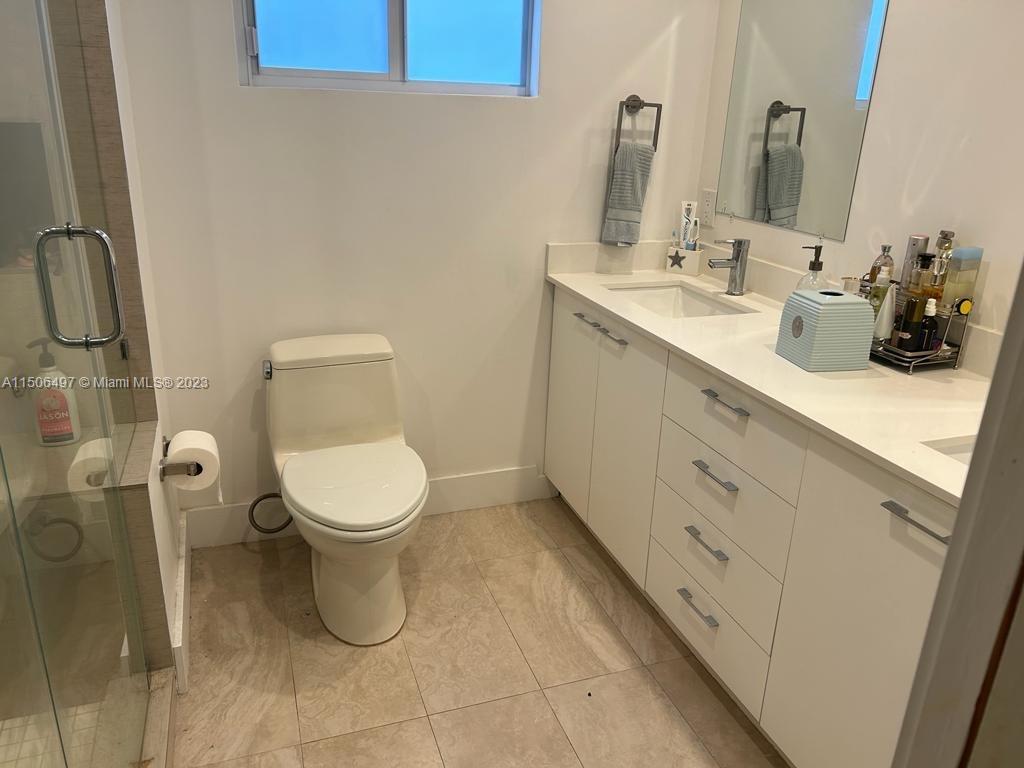 Coral Gate Miami, FL 33145 - Photo 8 of 13 a bathroom with a toilet sink and mirror