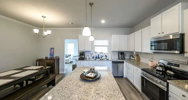 a kitchen with a stove and a sink