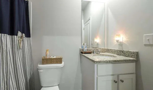 a room with furniture and a flat screen tv