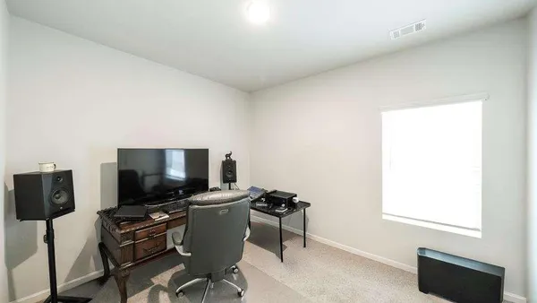 a room with furniture and wooden floor