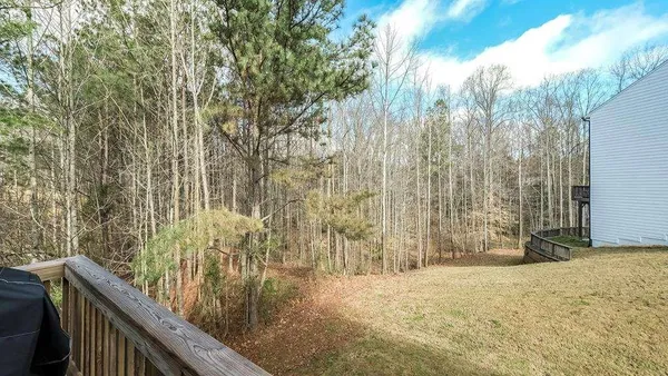 a view of wooden fence and trees