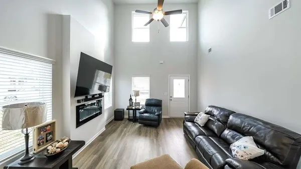a living room with furniture and a flat screen tv