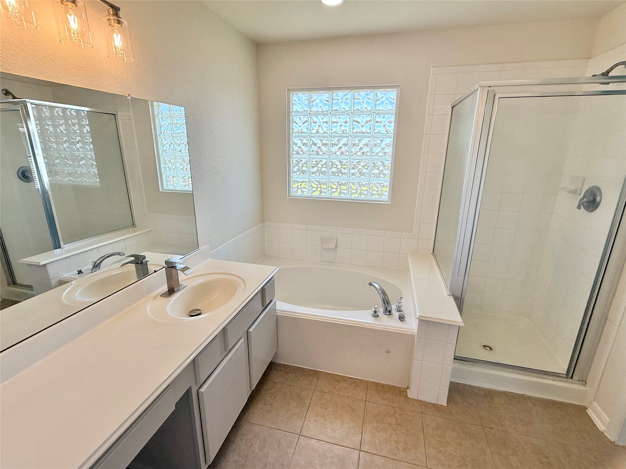 3430 Falcon Trail Court Spring, TX 77373 - Photo 24 of 31 Primary bathroom with a soaking tub, a standalone shower and a private toilet, also with access to the primary walk-in closet