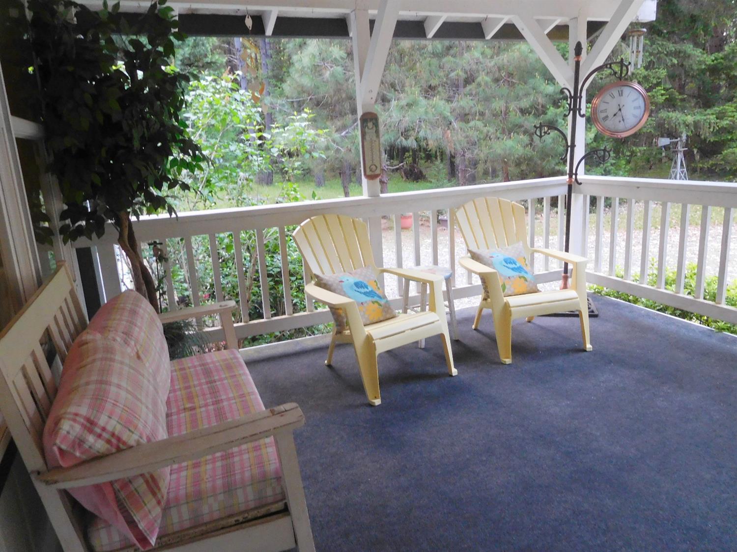 4933 Dick George Road Cave Junction, OR 97523 - Photo 3 of 22 Carpeted,covered front deck/porch.Faces