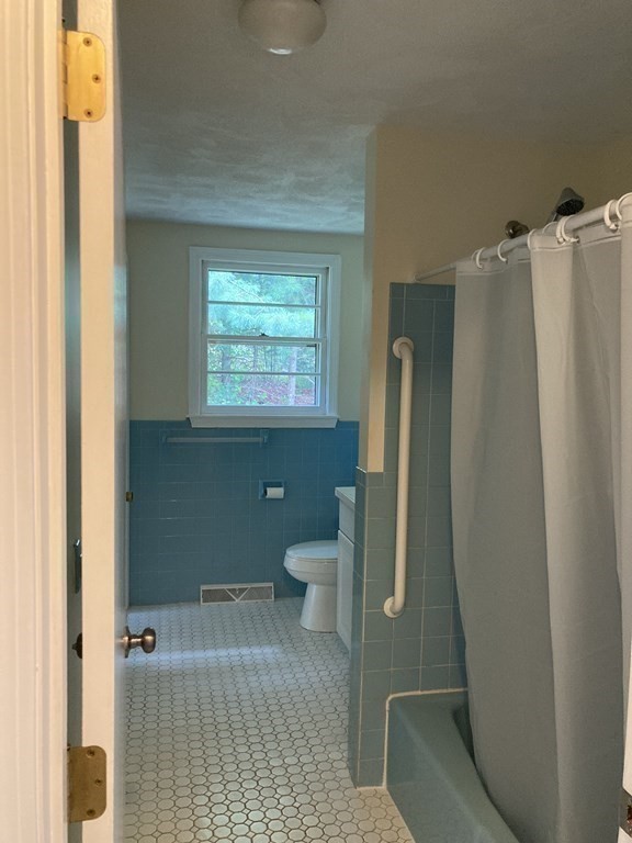 190 Fox Hill Road Burlington, MA 01803 - Photo 11 of 13 a bathroom with a toilet and a shower
