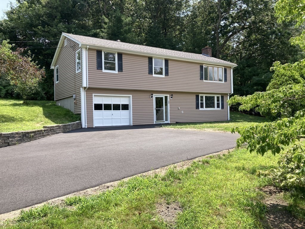 190 Fox Hill Road Burlington, MA 01803 - Photo 13 of 13 a front view of a house with a yard and garage