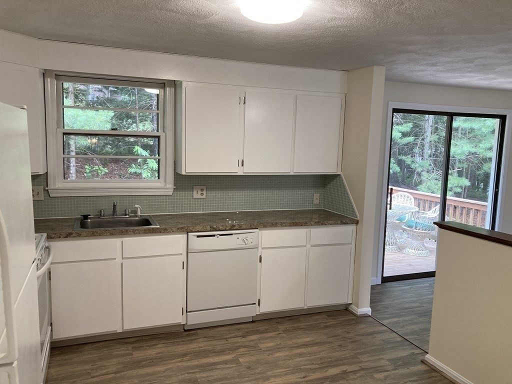 190 Fox Hill Road Burlington, MA 01803 - Photo 6 of 13 a kitchen with granite countertop white cabinets and a sink