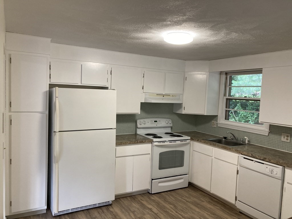 190 Fox Hill Road Burlington, MA 01803 - Photo 7 of 13 a white refrigerator freezer sitting inside of a kitchen